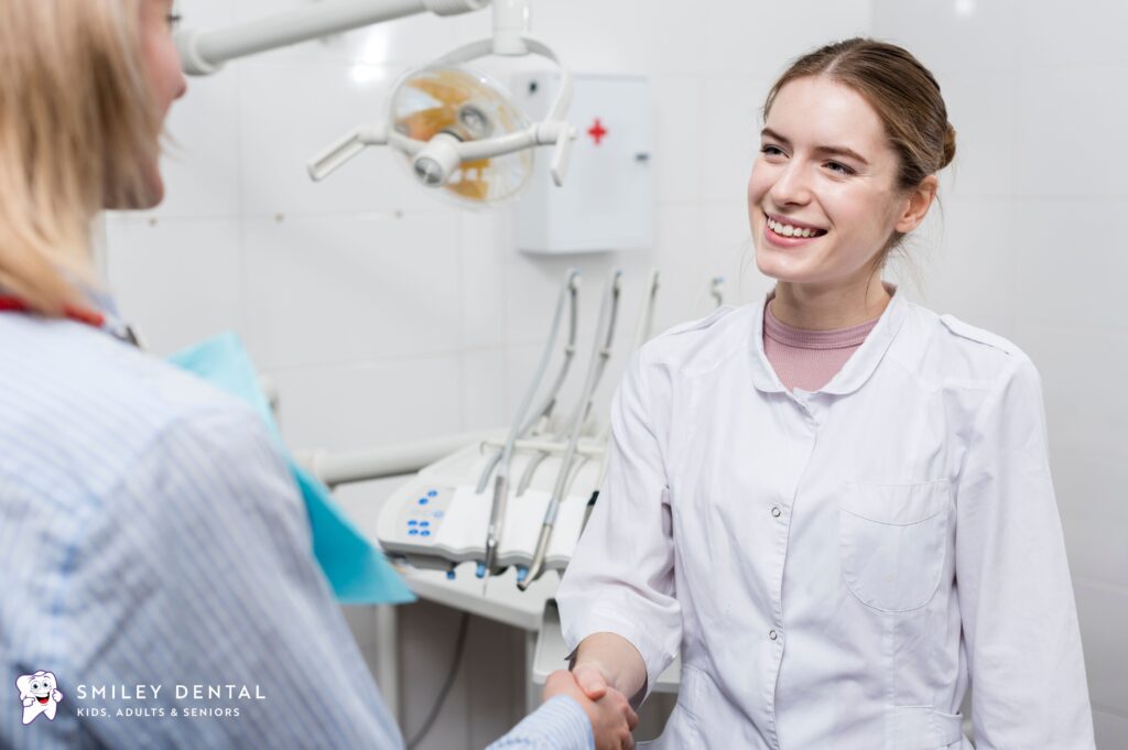 Dentist welcoming a patient with a handshake at a walk-in dental office in Boston