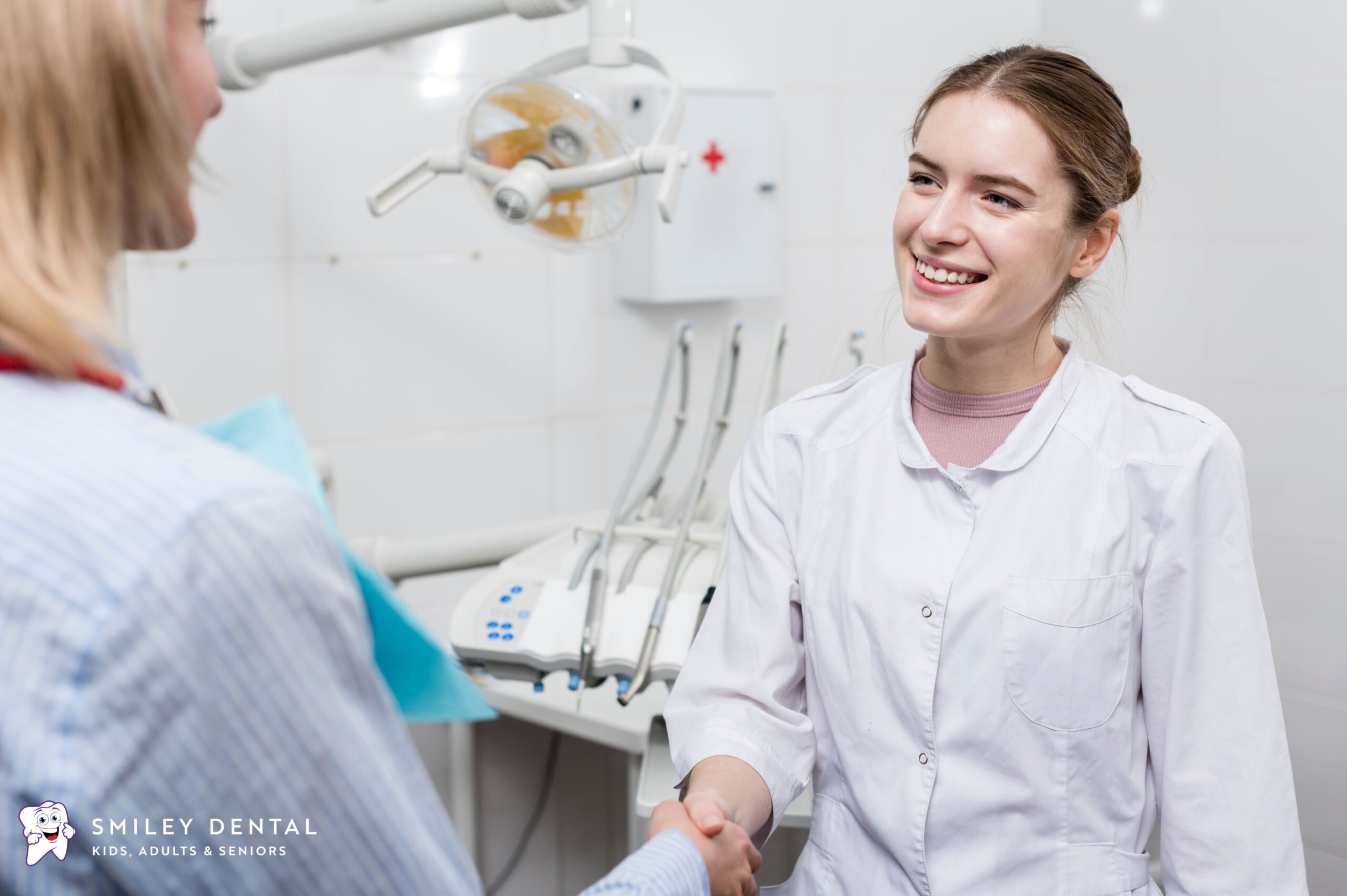 Dentist welcoming a patient with a handshake at a walk-in dental office in Boston