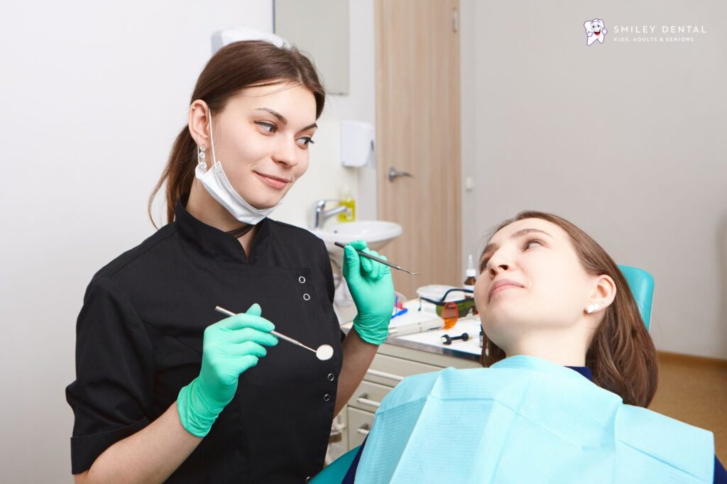 Dentist examining a patient's teeth during a dental consultation