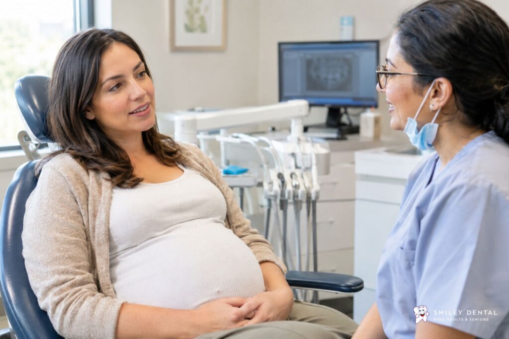 Pregnant woman in a dental chair consulting with a dentist about oral health during pregnancy